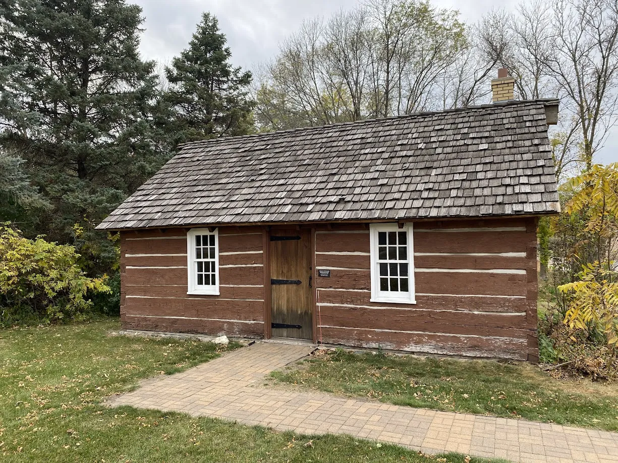 Historic 1857 Cabin originally on Wolsfeld Lake, now moved to City Hall.
