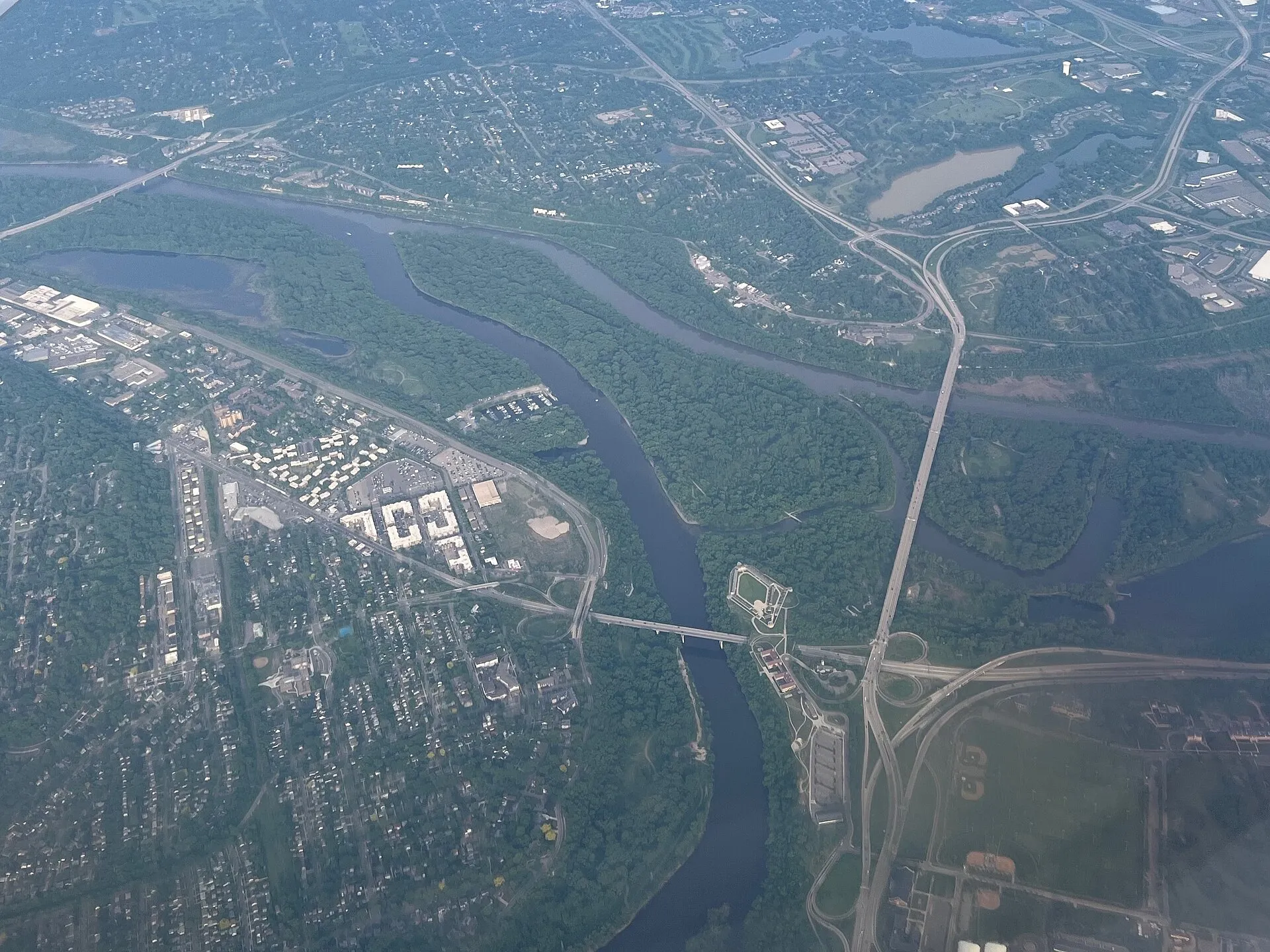 Aerial view of the confluence of the Minnesota and Mississippi Rivers in St. Paul, Mendota, and Mendota Heights, Minnesota in 2025. Three bridges carrying Inte