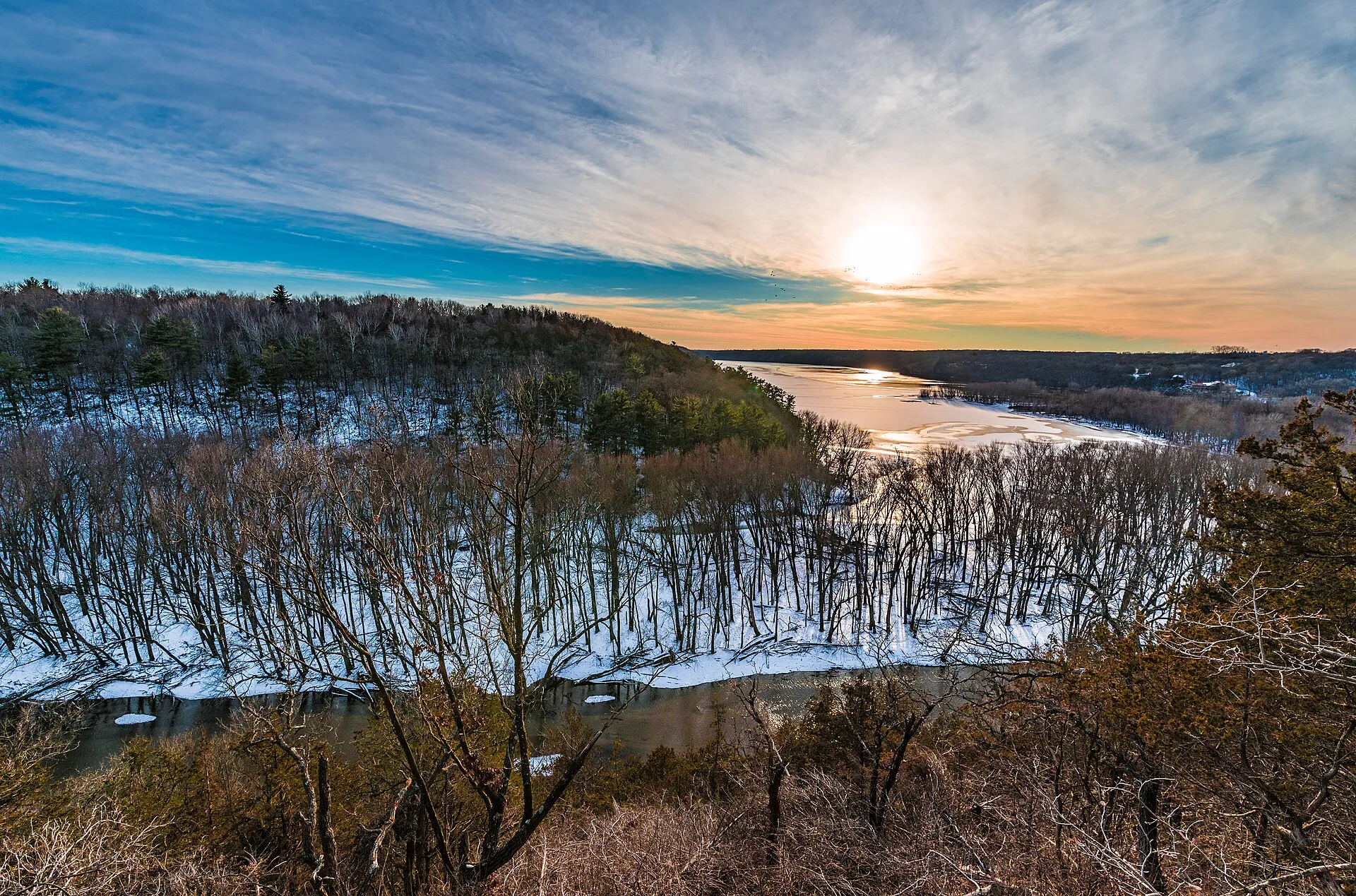 A winter sunset where the Kinnickinnic River meets the St. Croix River, at Kinnickinnic State Park