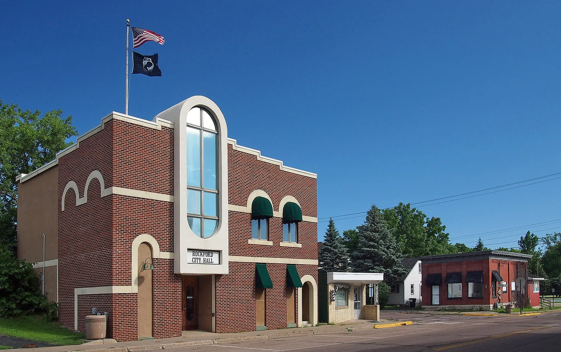 Rockford City Hall Main Street near its intersection with Bridge Street, Rockford, Minnesota, USA. View looking north with Rockford City Hall on left..