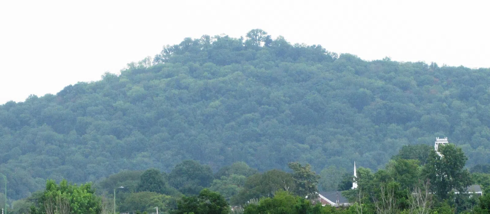Battery Knob, overlooking Carthage, Tennessee, USA, viewed from South Carthage. This hill was the location of a Civil War-era Union artillery battery that controlled traffic along the Cumberland River. The Smith County Courthouse is visible on the far right, next to the church.