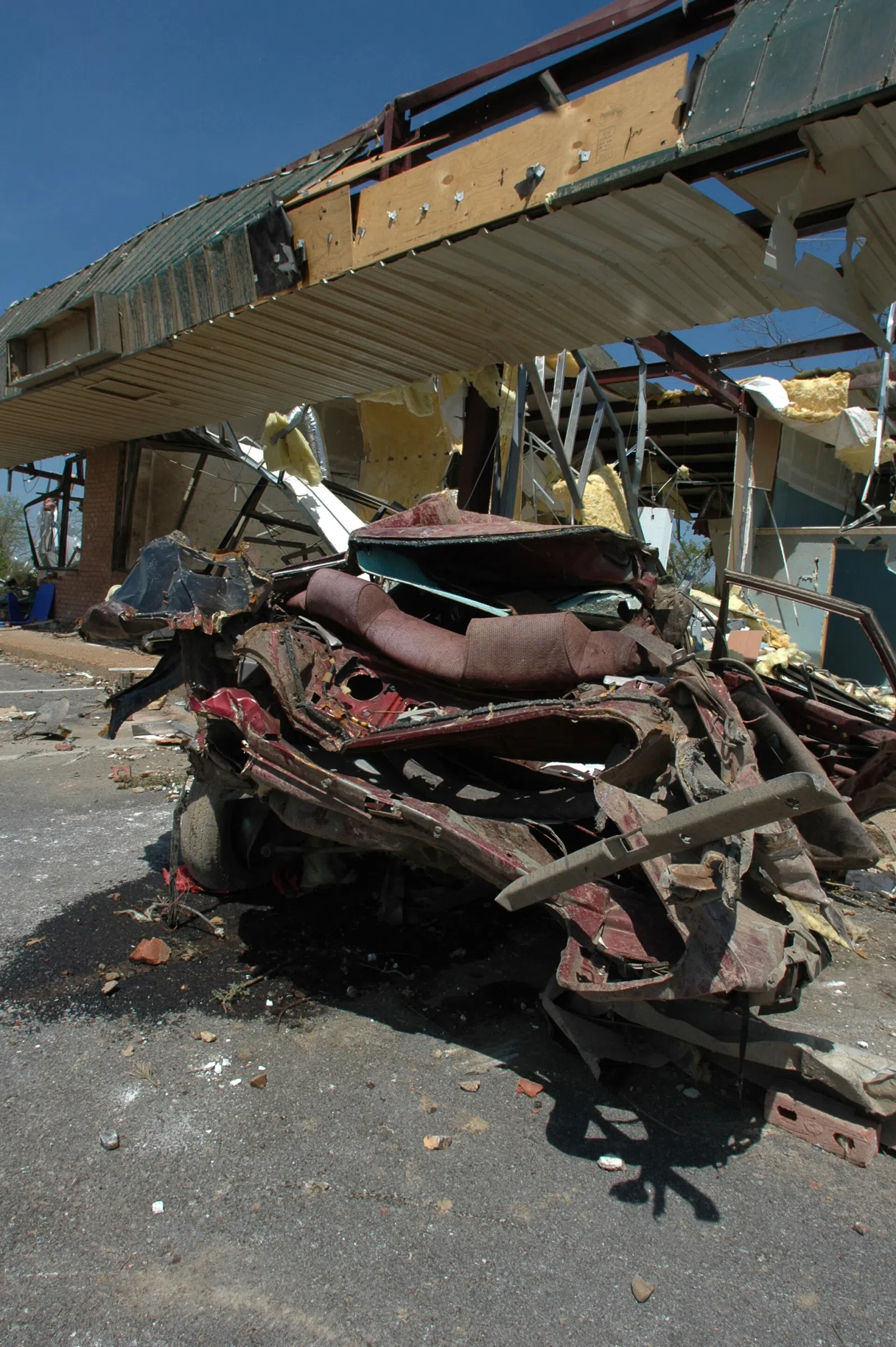 Gallatin, TN, April 15, 2006 -- A destroyed car at a dealership in downtown Gallatin. Middle Tennessee was recently hit by a series of tornadoes that damaged homes and office buildings. Leif Skoogfors/FEMA