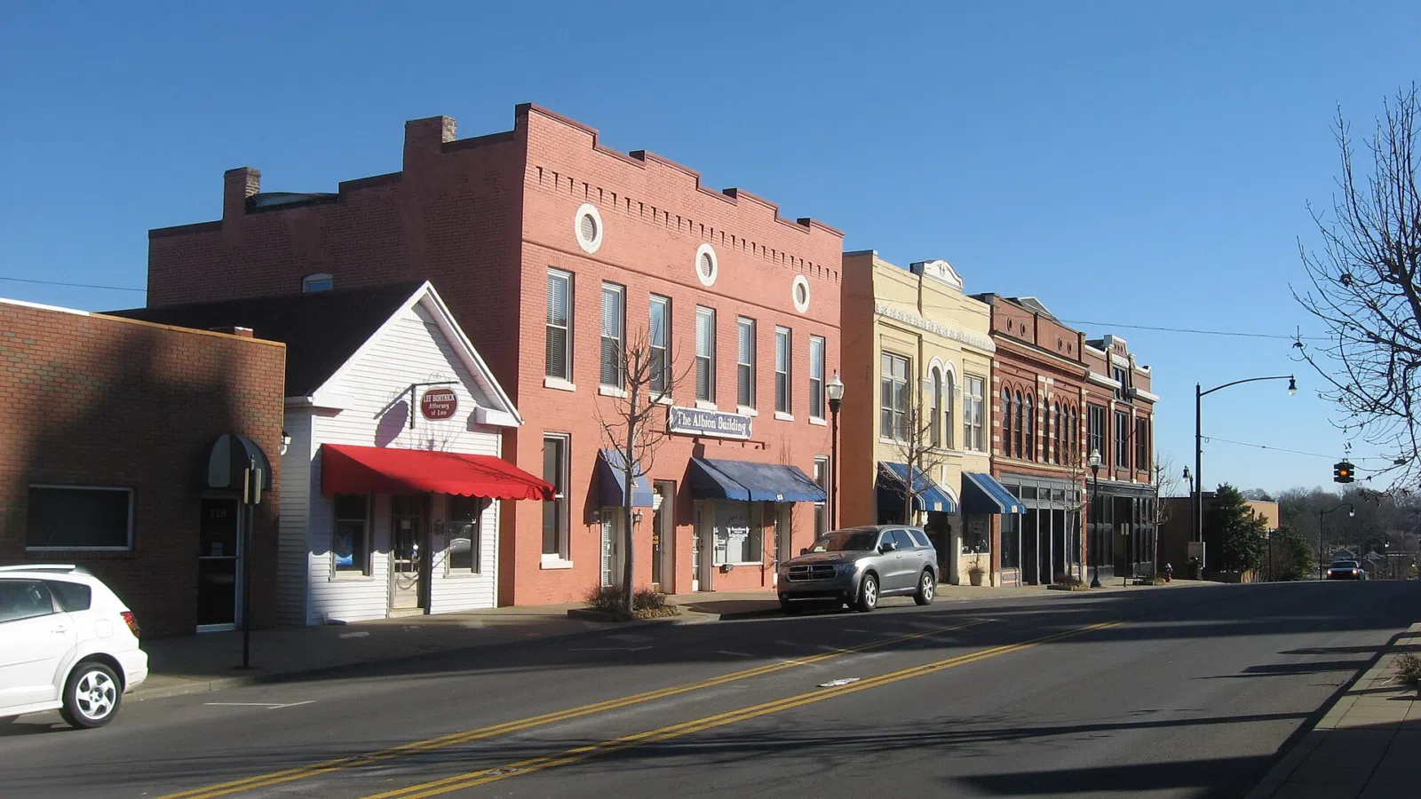 Buildings on the northern side of Fifth Avenue West ( State Route 49 ) on Courthouse Square in Springfield , Tennessee , United States . This block is part of the Springfield Town Square Historic District , a historic district that is listed on the National Register of Historic Places .