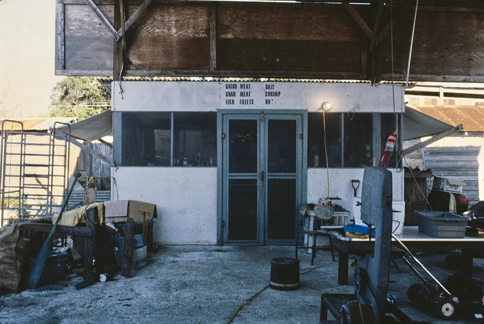 Barataria Louisiana 1985 Bisante's Seafood and Fur processing place Lettering above door reads: GATOR MEAT CRAB MEAT FISH FILLETS BAIT SHRIMP