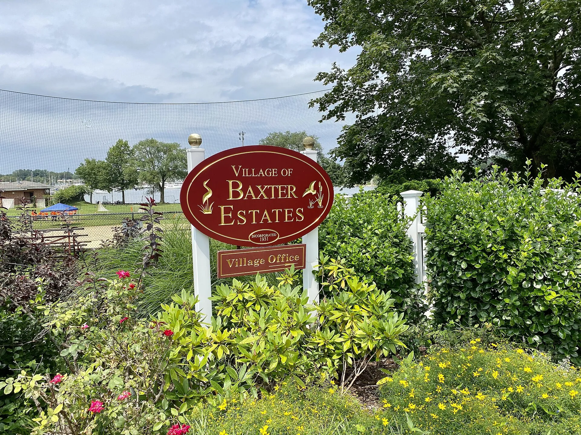 A village sign in front of the new Baxter Estates Village Hall in Baxter Estates, Long Island, New York on August 10, 2021