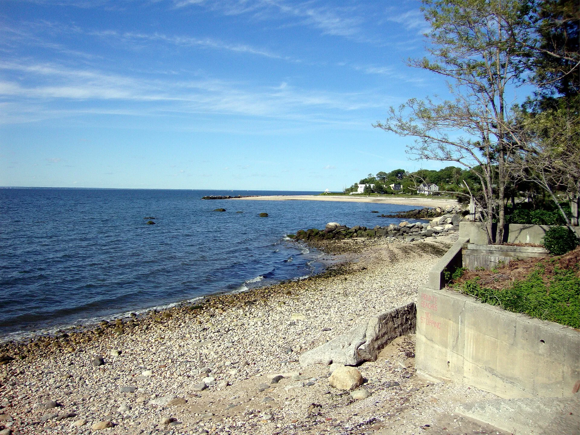 Village of Bayville, New York, situated on the Long Island Sound. A private beach filled with rock