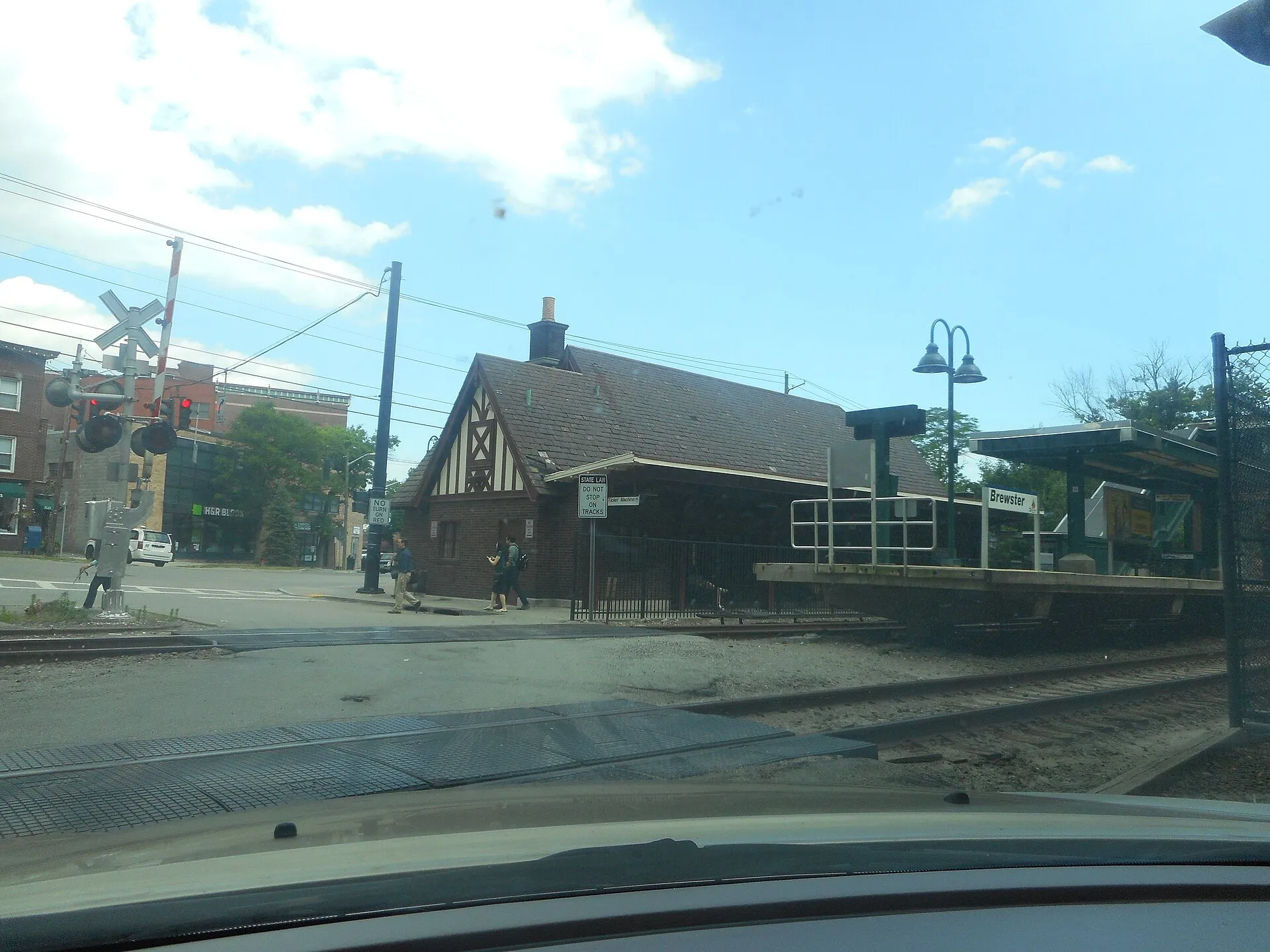 Northern edge of the Metro-North platform at the Ellen Avenue crossing, Brewster Metro-North station; the 1931 former New York Central station house is behind the Wassaic-bound tracks