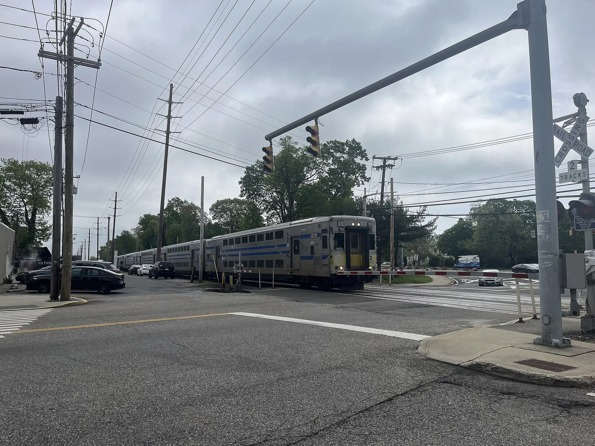 An LIRR train passing through Brightwaters (May 2025)
