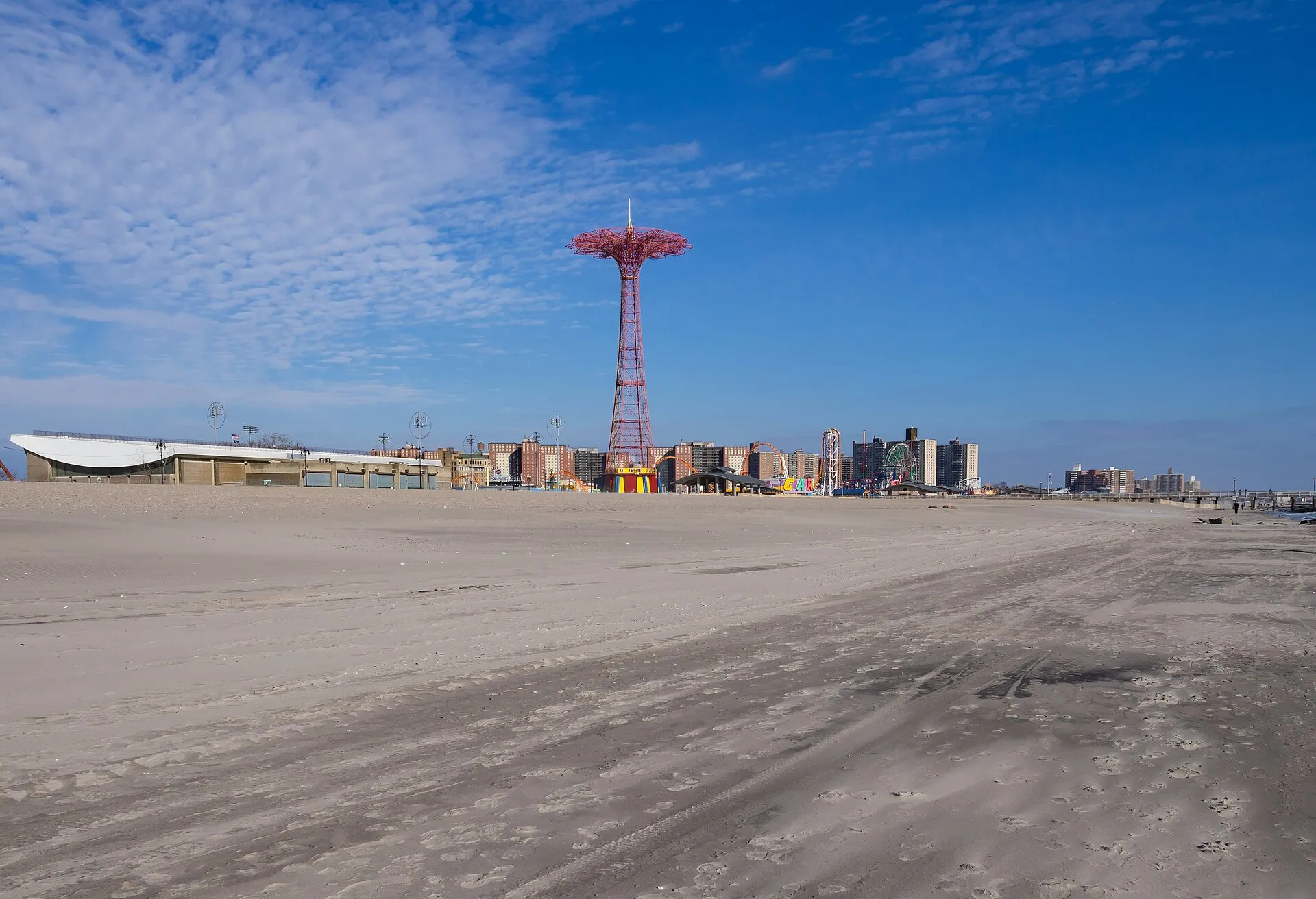 Coney Island Beach and Boardwalk in the winter, with the Parachute Jump in the distance