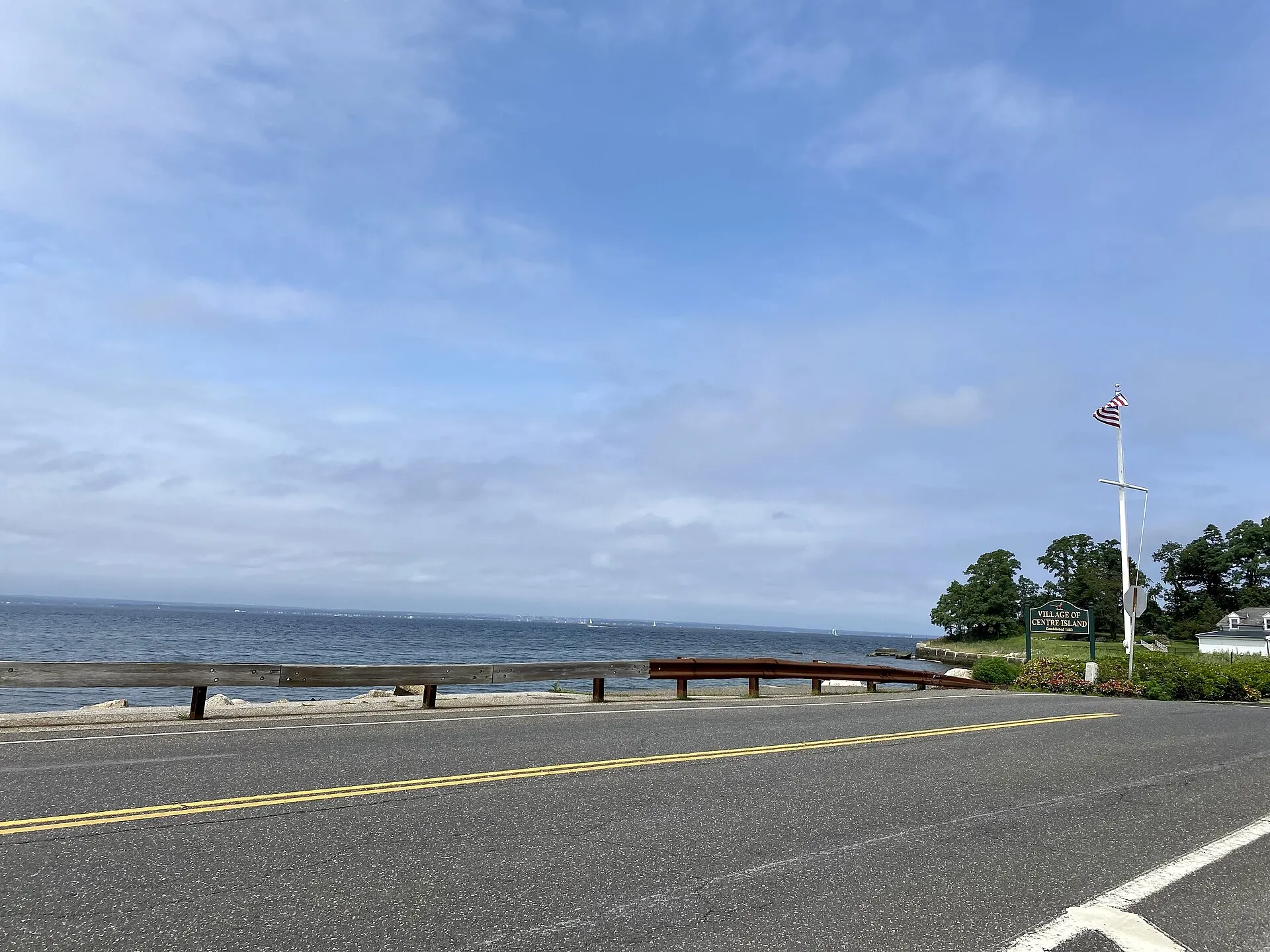 The Long Island Sound in Bayville, Long Island, New York on August 29, 2021. This photo was taken on Centre Island Road, just west of the entrance to that village (the welcome sign is visible at