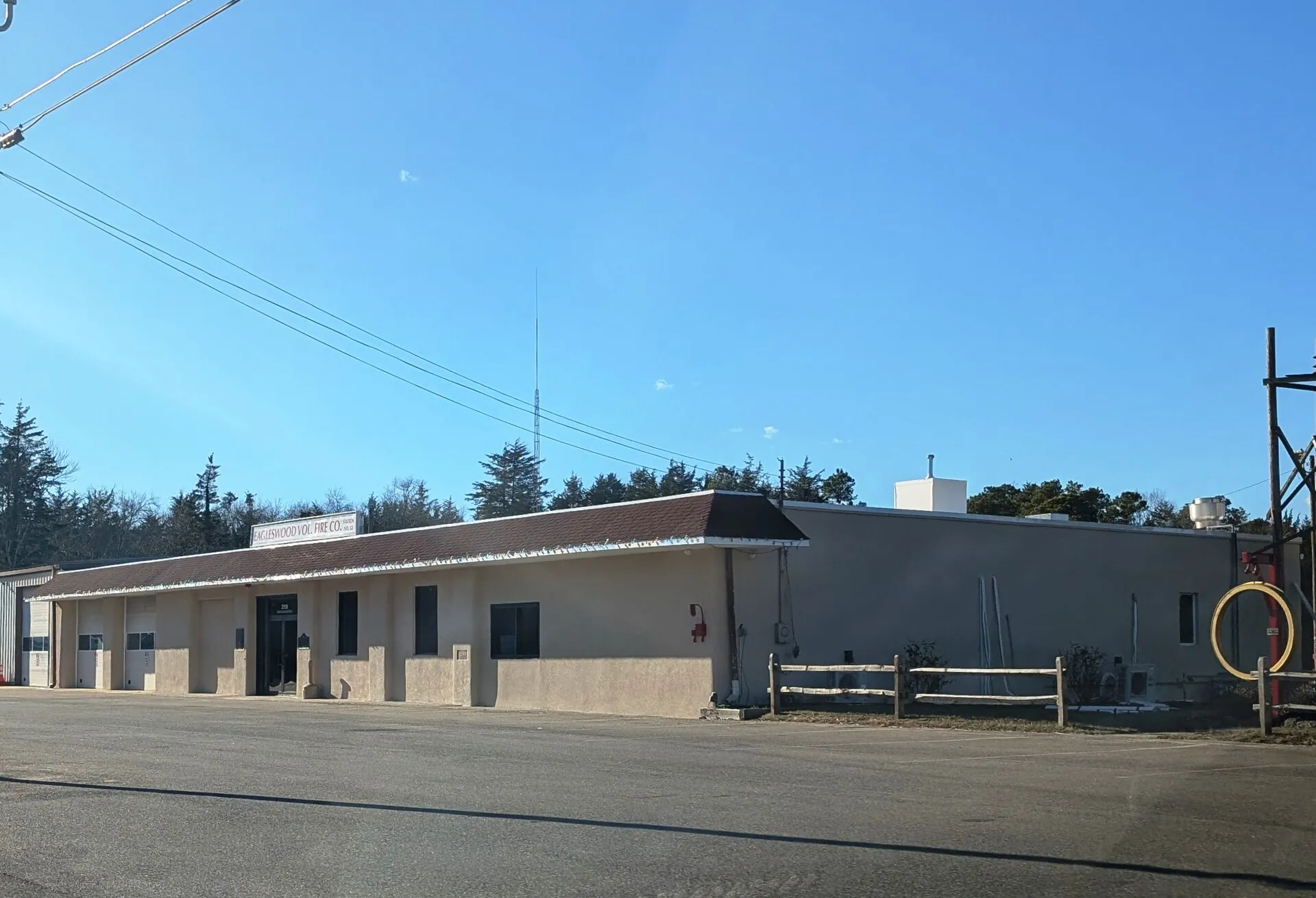 Photo of Eagleswood Volunteer Fire Company - Station No. 52 in Eagleswood Township, New Jersey. Photo taken from County Route 35 (Railroad Avenue) looking west-southwest