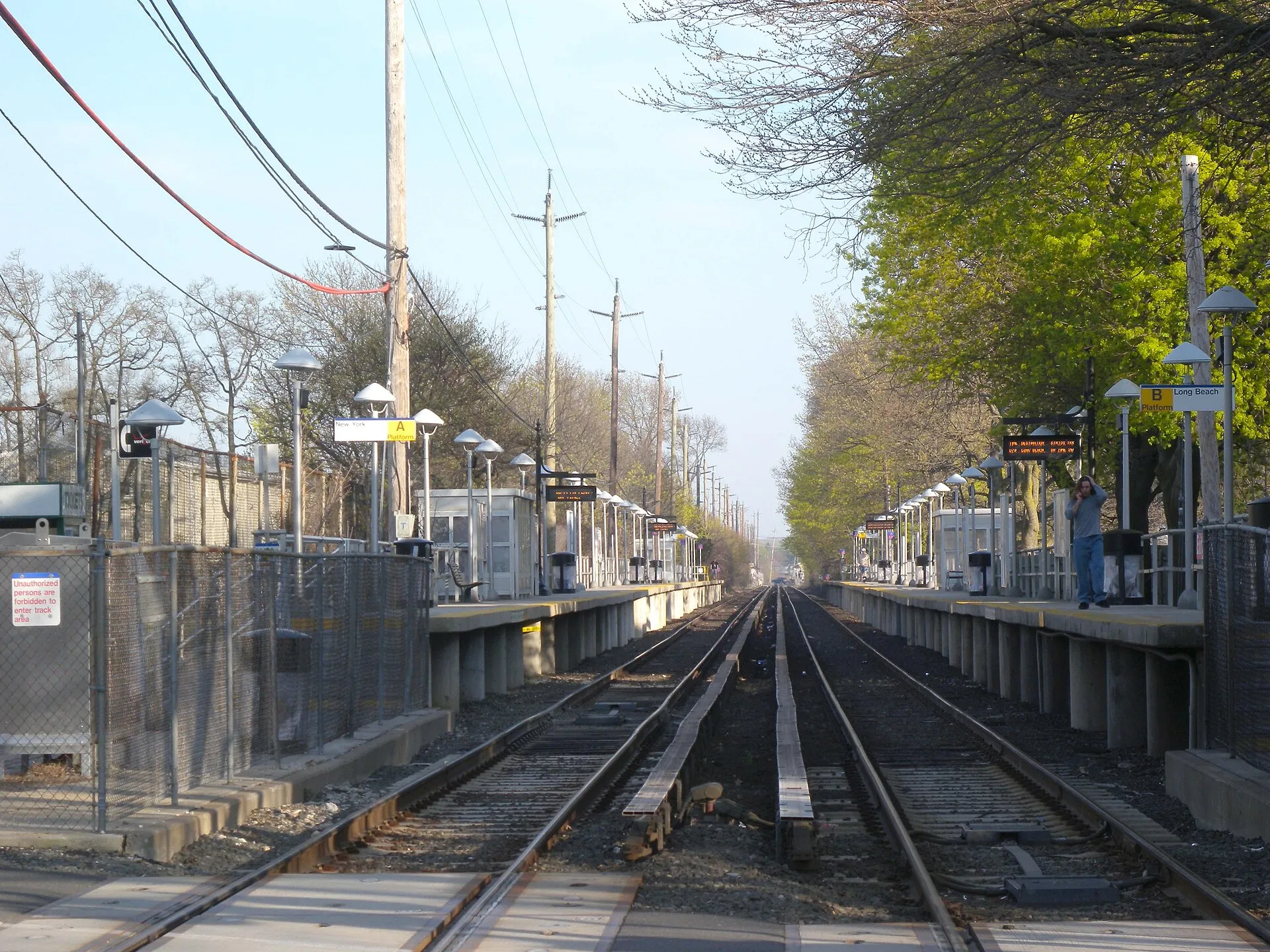 Looking southeast at Centre Avenue station of LIRR, late on a sunny afternoon
