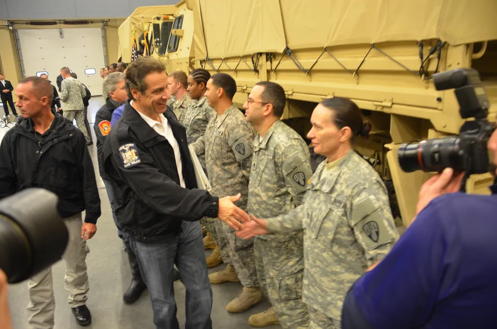 New York Gov. Andrew Cuomo greets members of the New York Army National Guard's 206th Military Police Company during a visit to the Farmingdale Armed Forces Reserve Center, Oct. 29. The governor