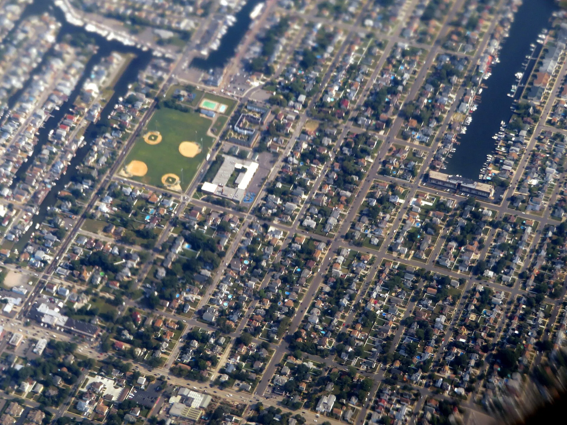 Aerial view of a neighborhood in Freeport, New York in August 2019. John J. Randall Park is visible