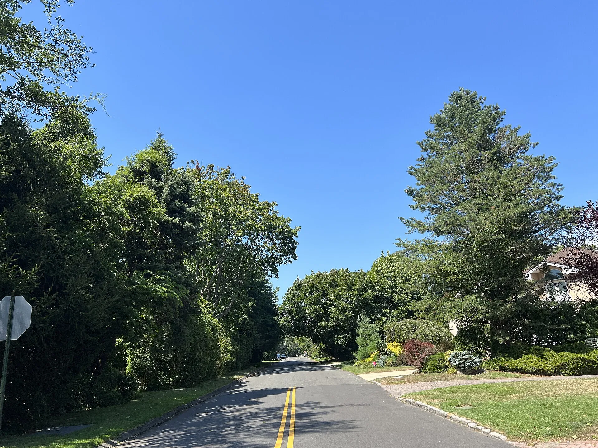 Auerbach Avenue in the Inc. Village of Hewlett Harbor, NY on August 8, 2022, as seen from its intersection with Bayberry North