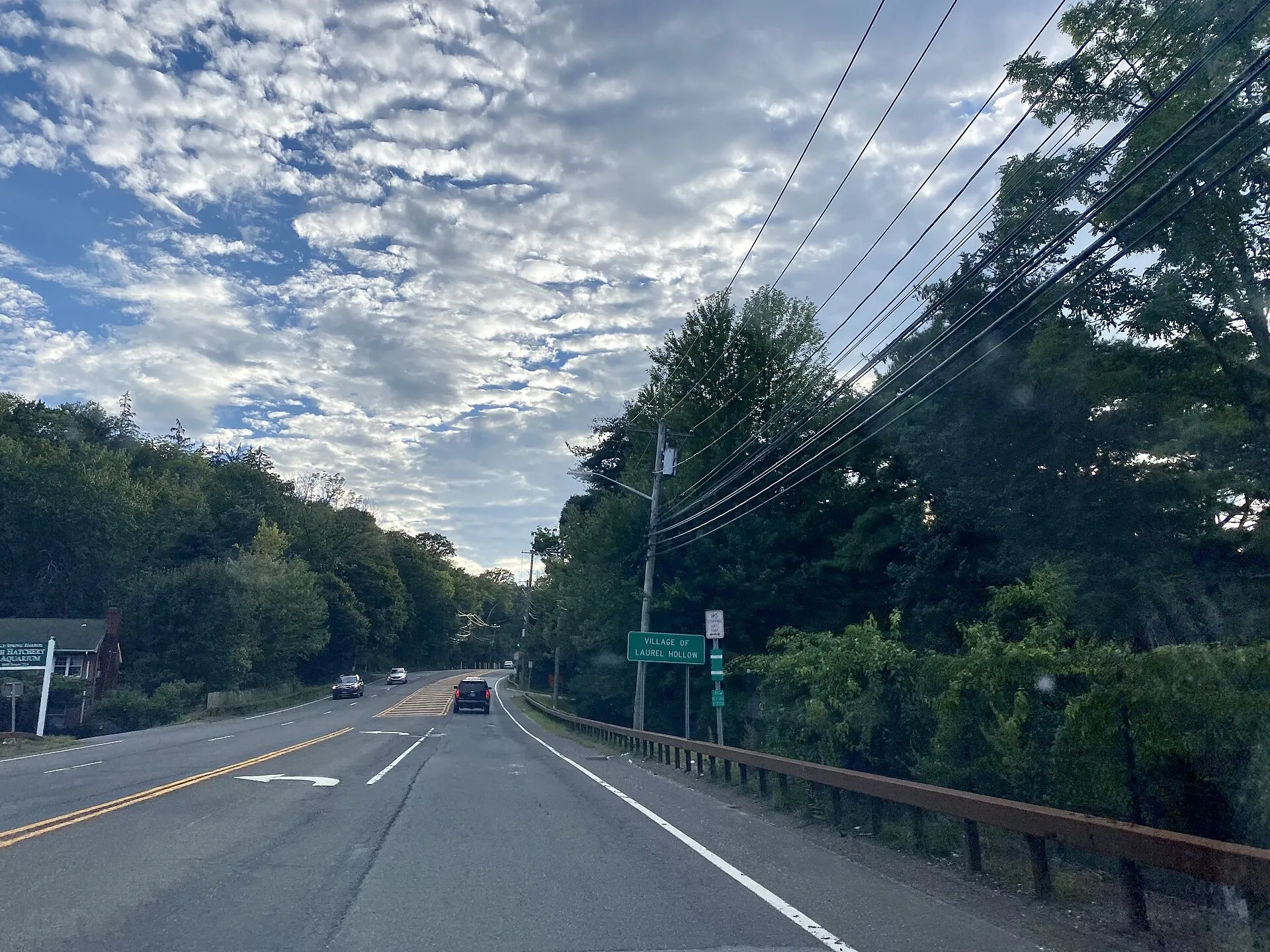 A welcome sign at the entrance to Laurel Hollow, Long Island, New York on August 15, 2021. This sign is located on NY 25A, just west of the Nassau–Suffolk County border