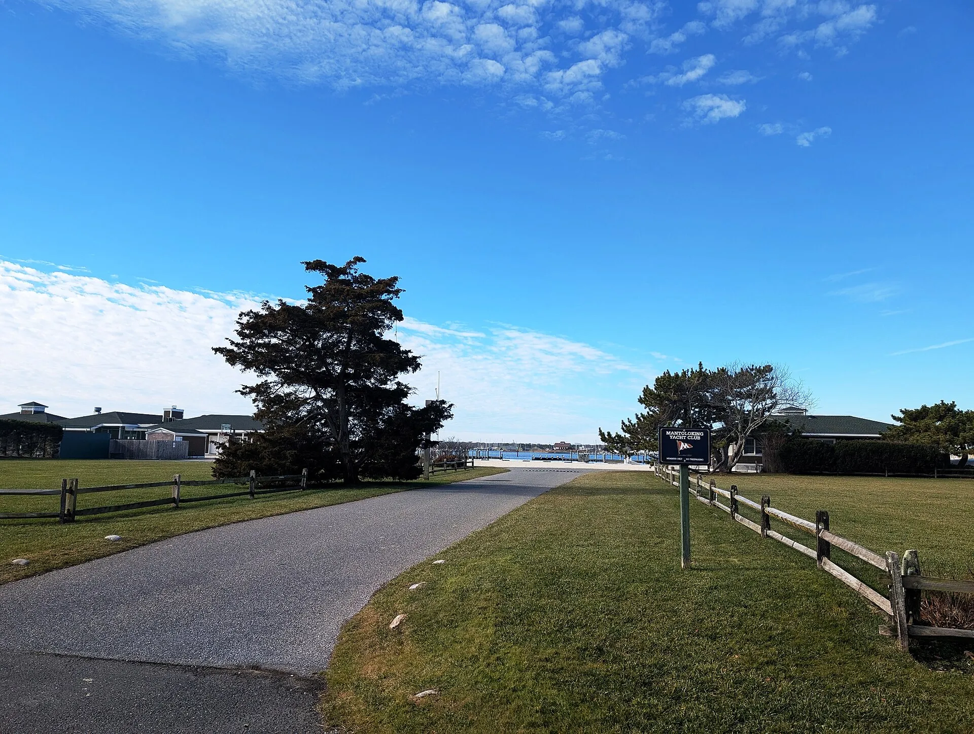Photo of the Mantoloking Yacht Club site in Mantoloking, New Jersey. Photo taken from Bay Avenue looking west along Lake Street