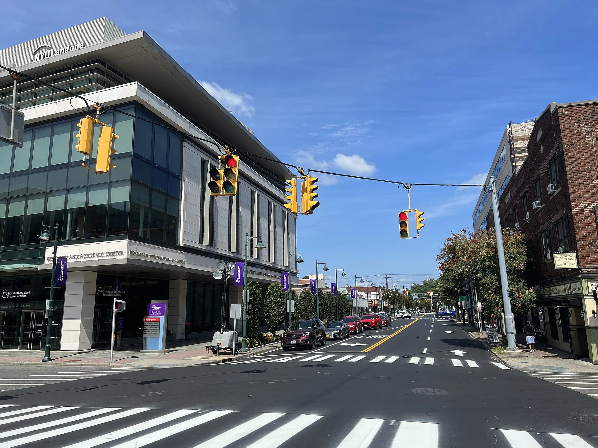 Mineola Boulevard in downtown Mineola, with NYU Langone Winthrop Hospital visible in the distance, August 2023