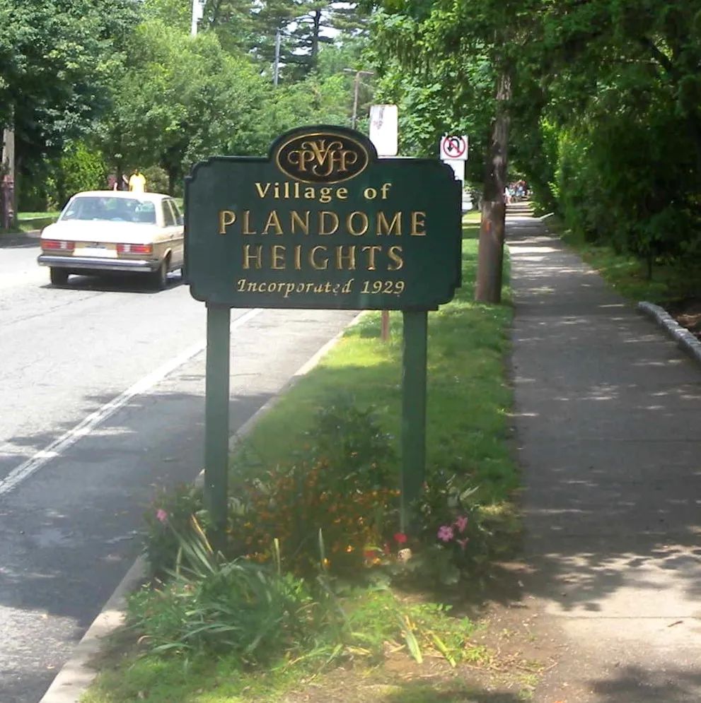 The Plandome Heights sign (1929) on a sunny day