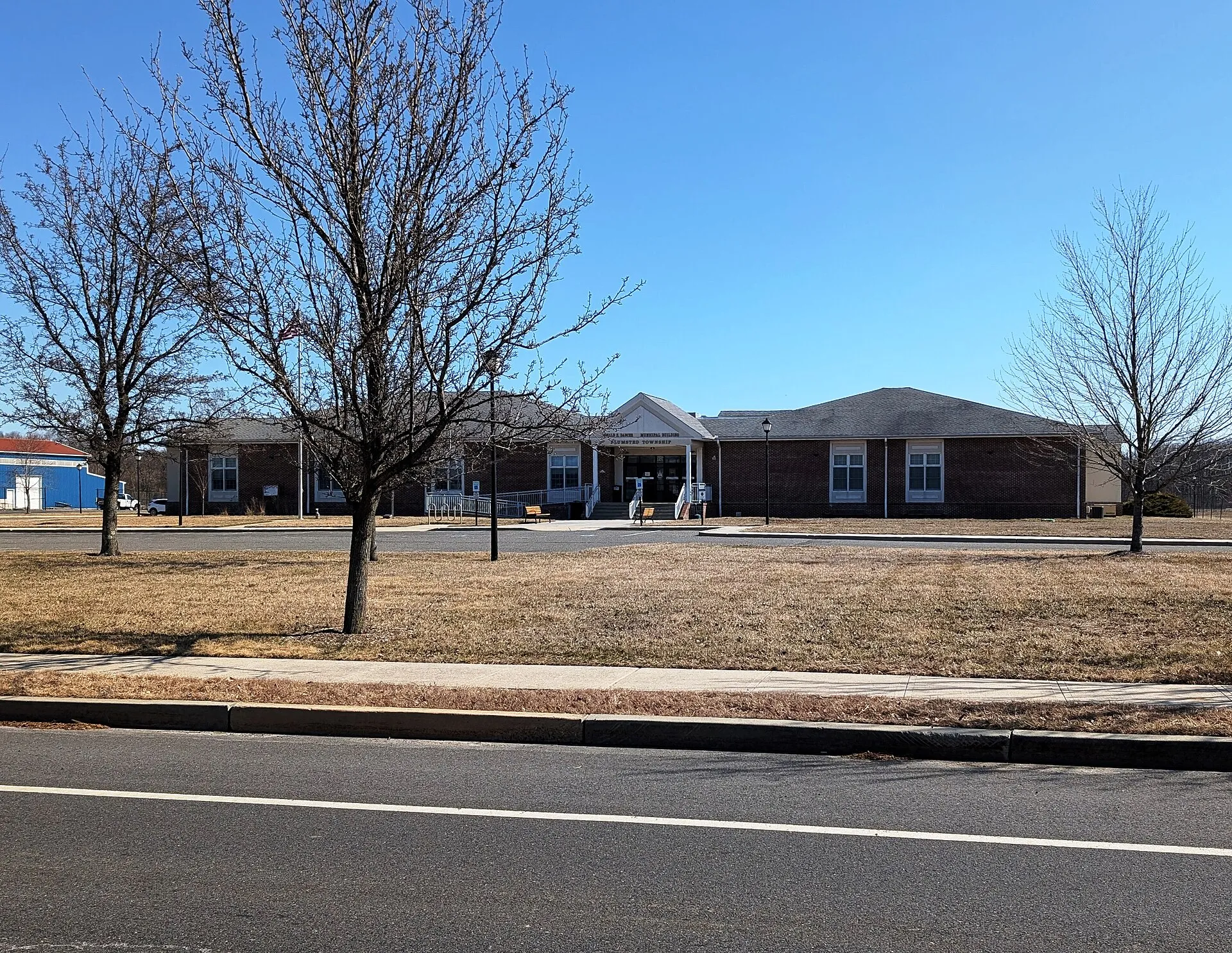 Photo of the Plumsted Township, New Jersey Municipal Building. Photo taken from Evergreen Road looking east