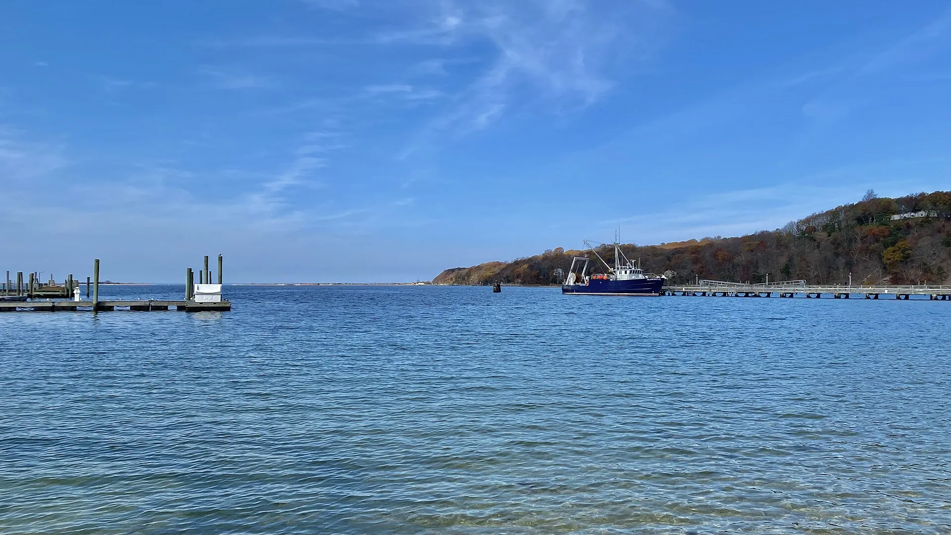 A view a cross the harbor at Port Jefferson, New York on a November 2022 afternoon. Once an active shipbuilding port and for most of the