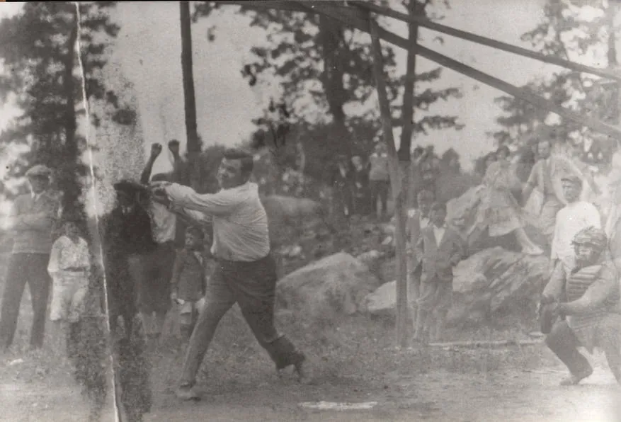 Black & white photo of Babe Ruth playing baseball with local children near Oscawana Lake, Putnam Valley, N.Y