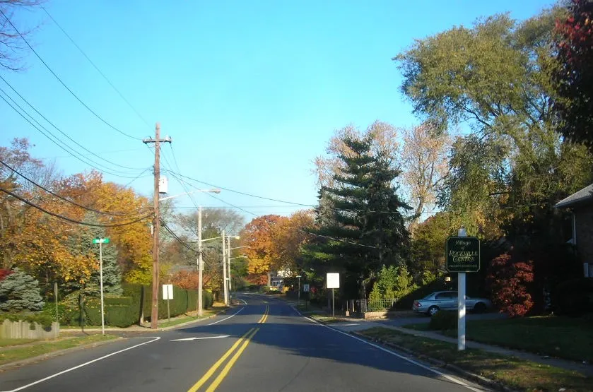 Rockville Centre street with the welcome sign in view