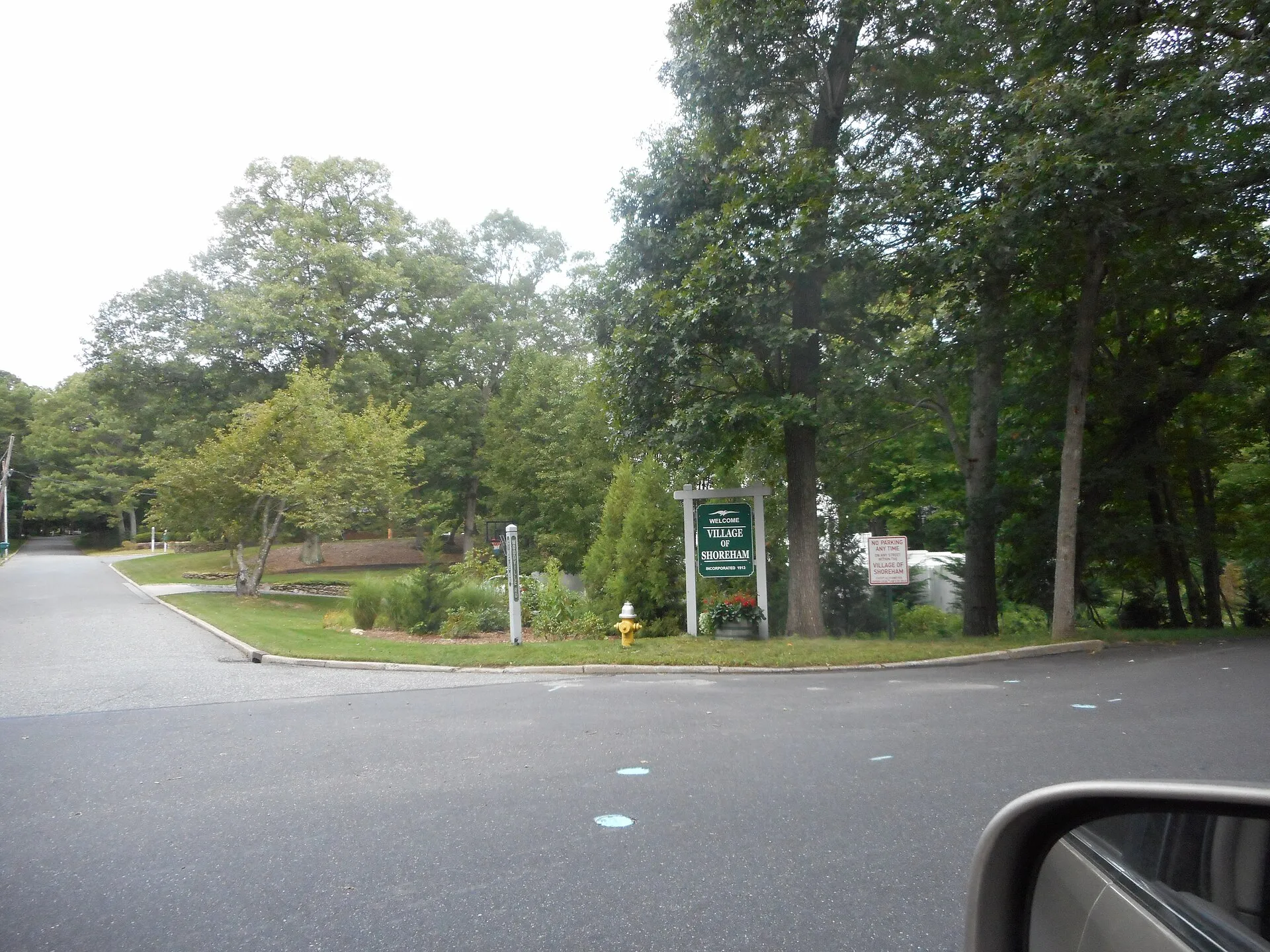 A welcome sign at the northwest corner of Woodville Road and Circle Drive in Shoreham, New York