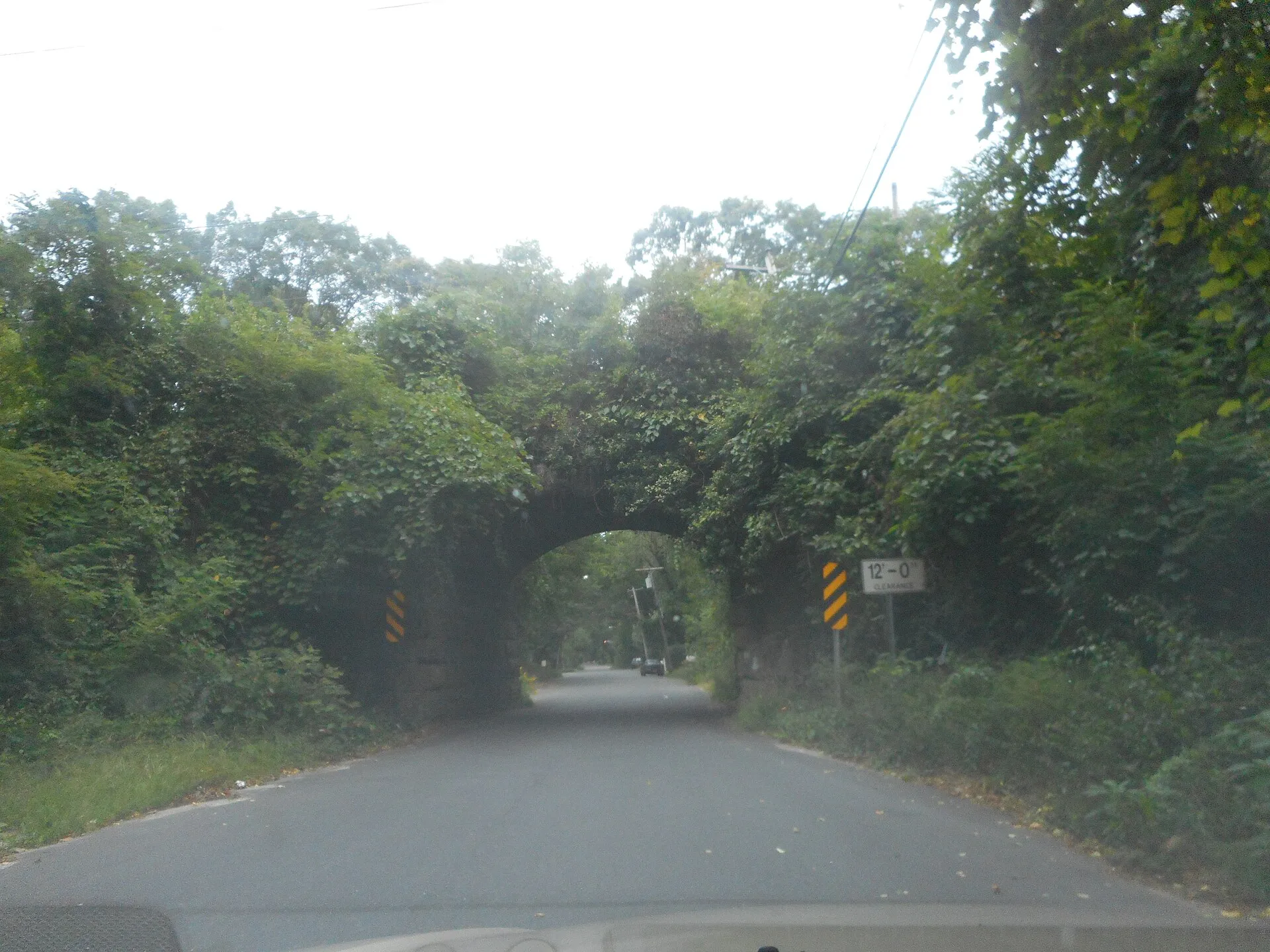 The one-lane bridge over Woodville Road in Shoreham, New York that used to carry the Long Island Rail Road Wading River Branch