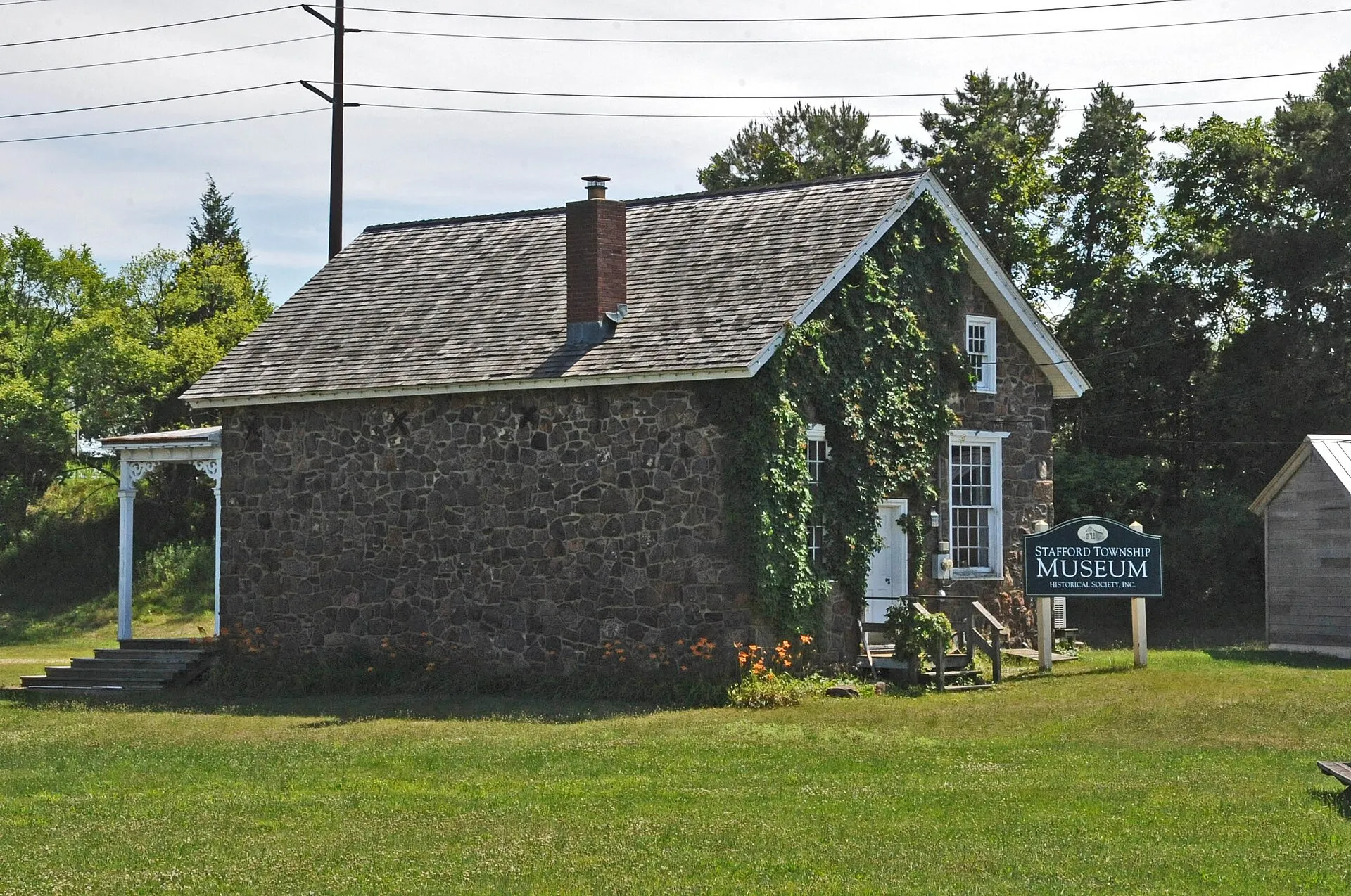 THIS BUILDING MAY BE ONE OF TWO RAILROAD STATIONS IN THE AREA WHICH WERE MOVED TO THE STAFFORD TOWNSHIP HERITAGE PARK AREA. IT PROBABLY DATES FROM CIRCA 1872