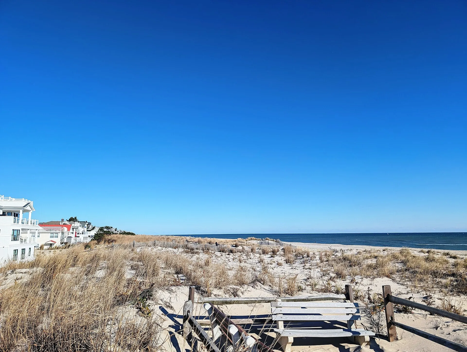 Photo of the dunes and ocean beach in Surf City, New Jersey. Photo taken from the beach entrance at Division Avenue looking northeast