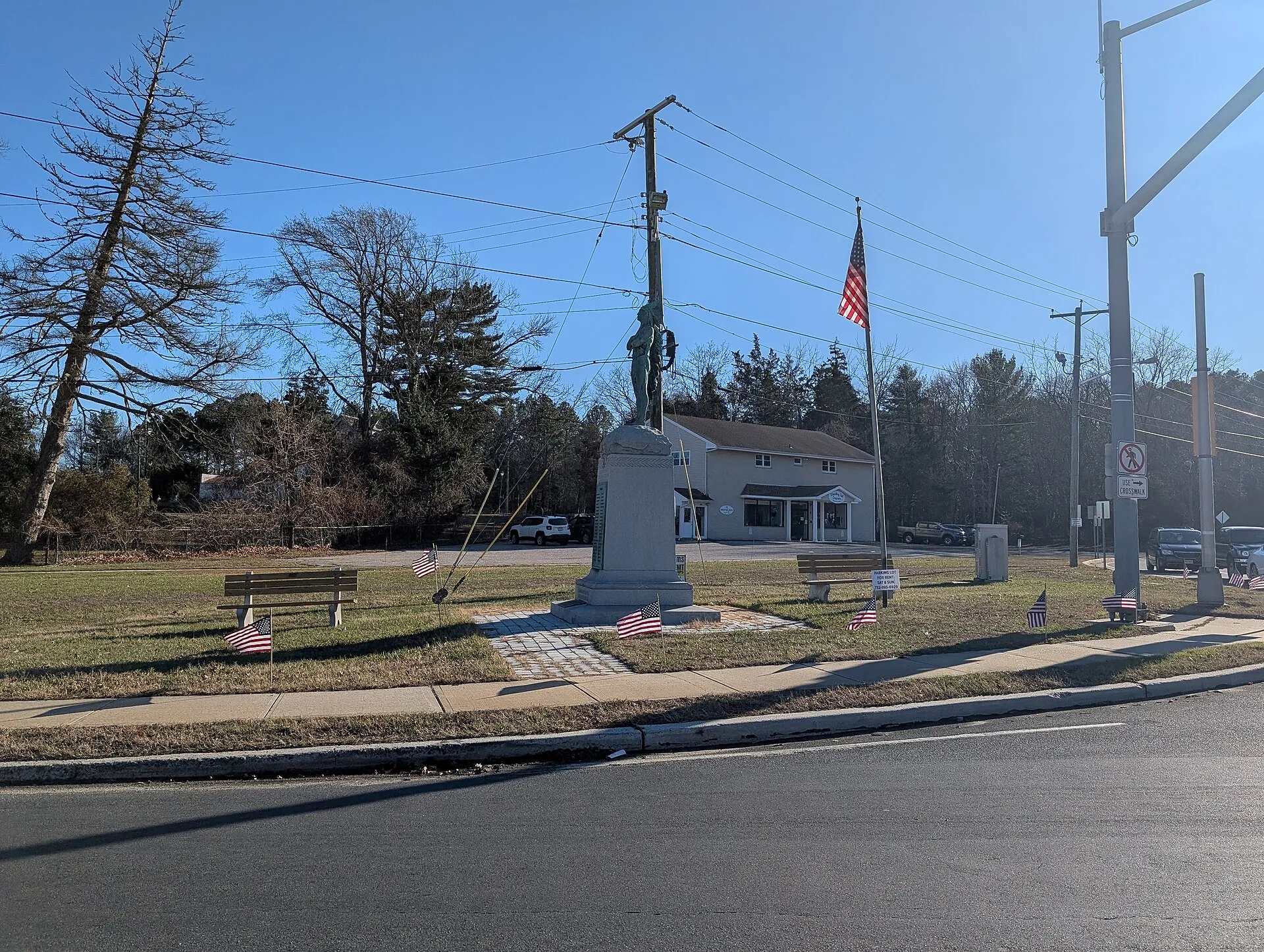Photo of the Chief Pohatcong Statue, a monument to Native American veterans in World War I, in Tuckerton, New Jersey. Photo taken from U.S. Route 9 (West Main Street) at County Route 601 (Great Bay Boulevard) looking