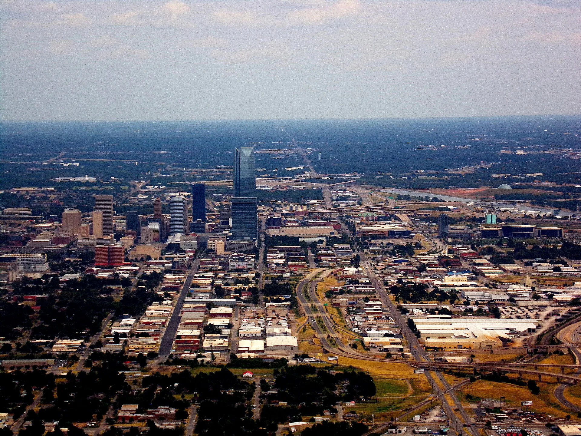Aerial view of downtown Oklahoma City, facing east on final approach to Will Rogers World Airport (August 2022).