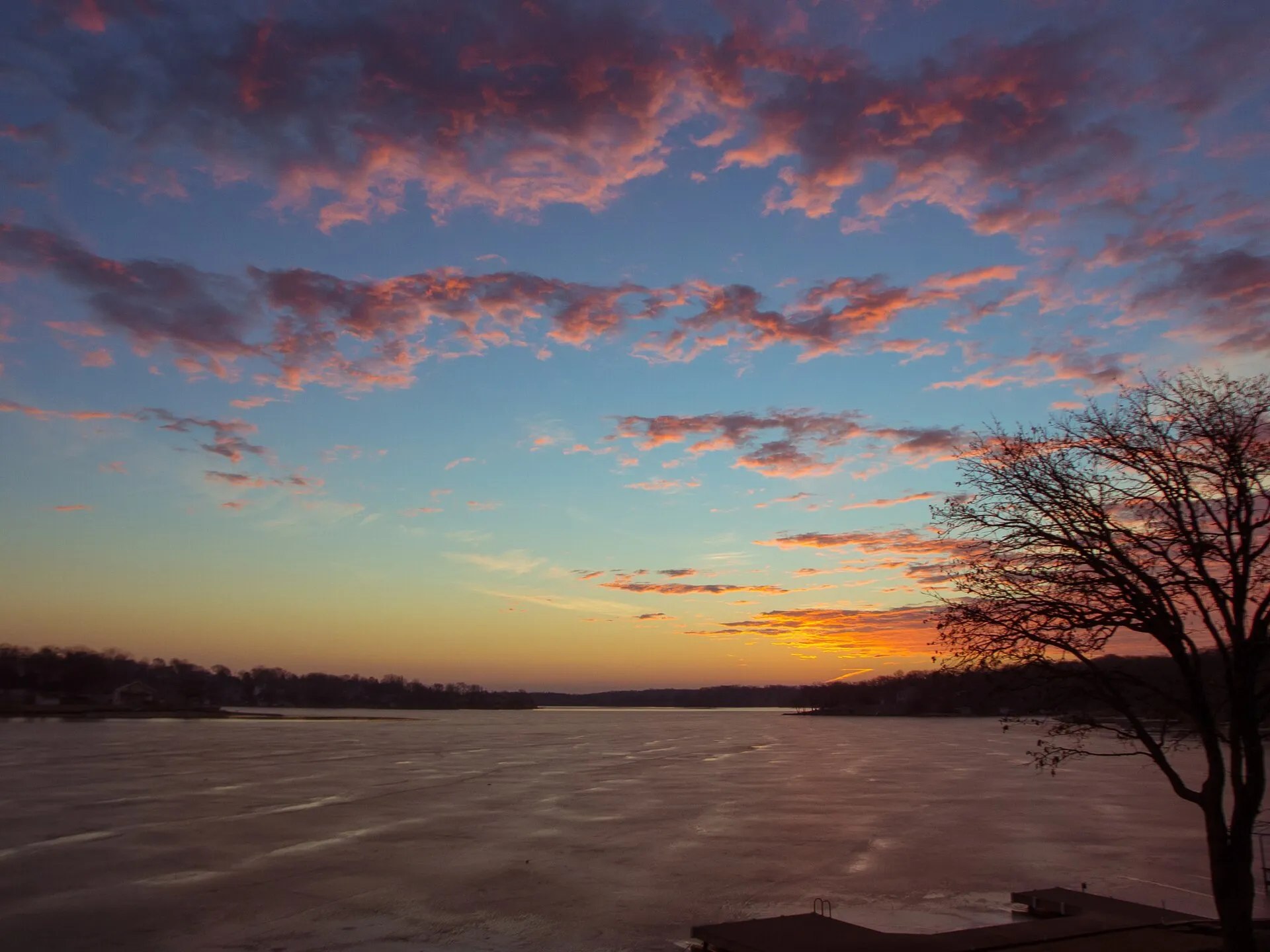 Sun rises over frozen Beaver Lake near Plattsmouth, Nebraska.