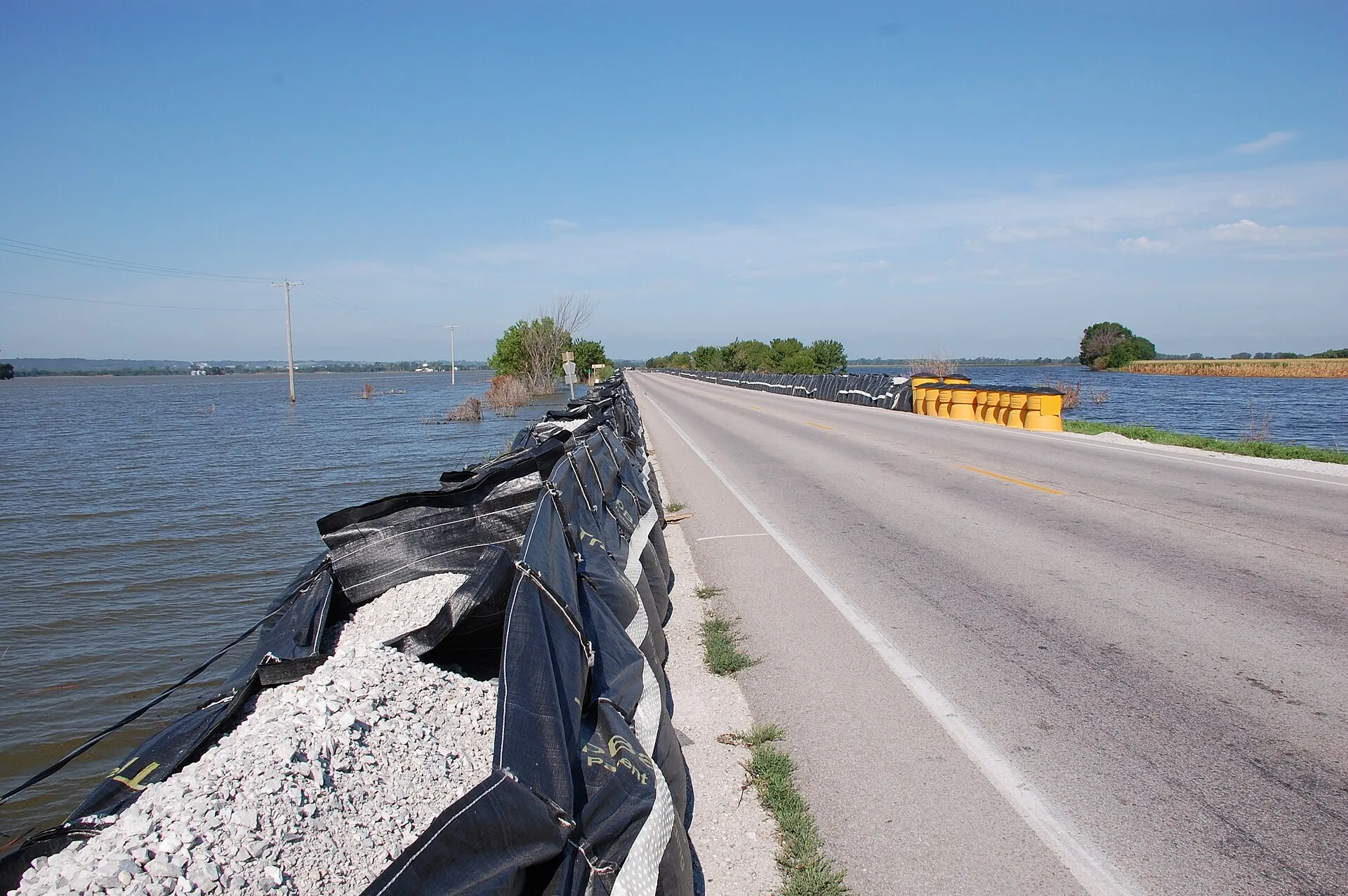 The original database describes this as: Title: Flood Barrier Protects Critical Highway Production Date: 08/02/2011 Caption: Blair, Neb. , August 2, 2011 -- A flood barrier keeps the Missouri River fl