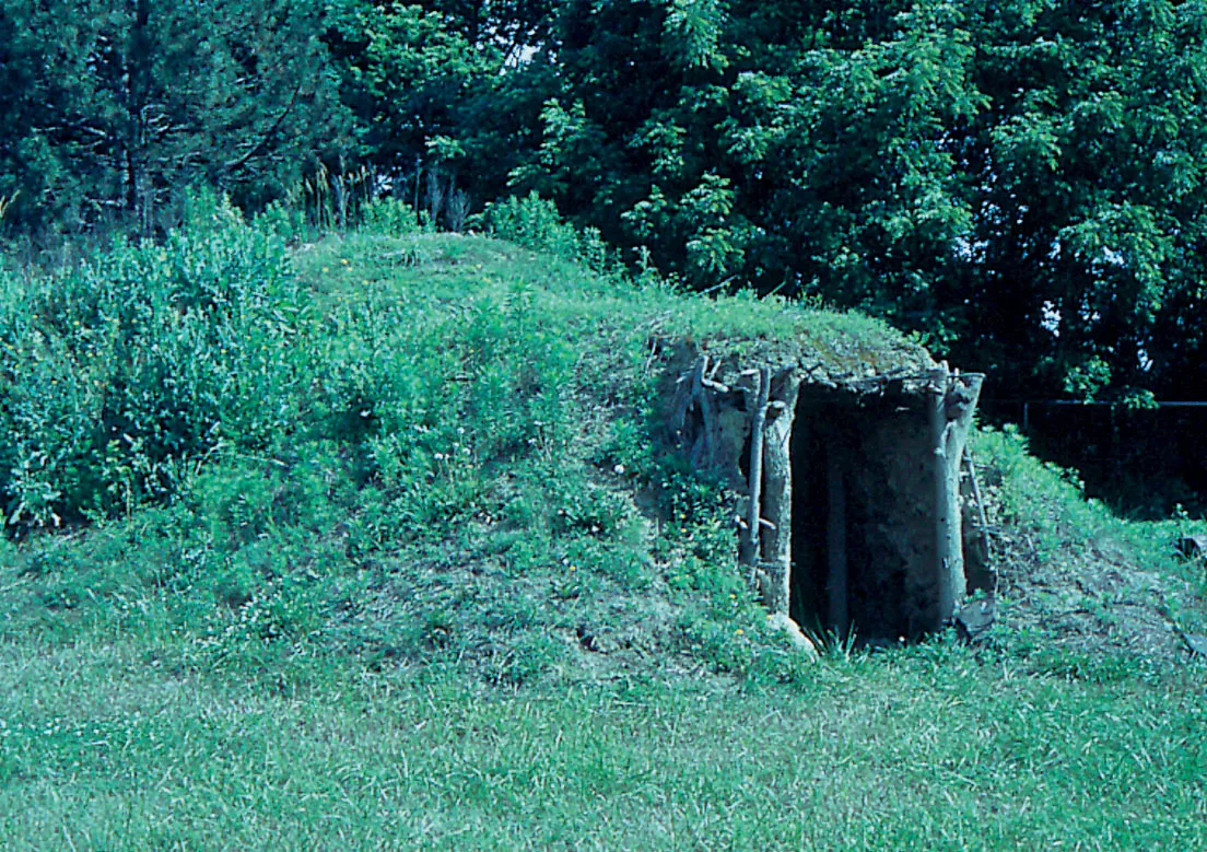 Scope and content: The original finding aid described this photograph as: Original Caption: This sod-covered earthen structure is a replica of the Indian earth lodges used between 1250-1500 AD. Locati