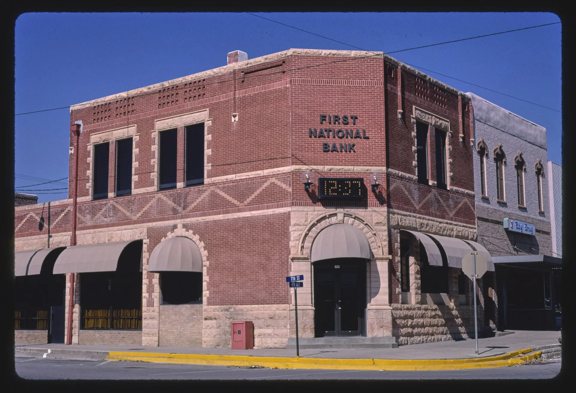 Title: First National Bank, 7th Street & 4th Avenue, Logan, Iowa Physical description: 1 photograph : color transparency ; 35 mm (slide format). Notes: Margolies categories: Banks; Main Street.; P