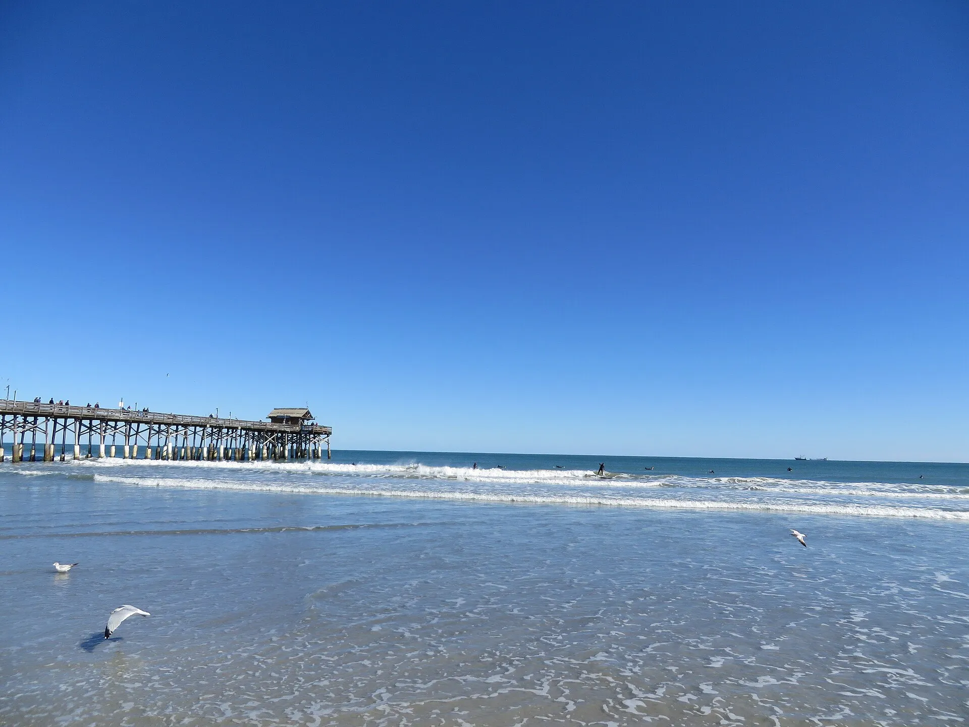 Surfing at the Cocoa Beach Pier, 401 Meade Avenue, Cocoa Beach, Florida.