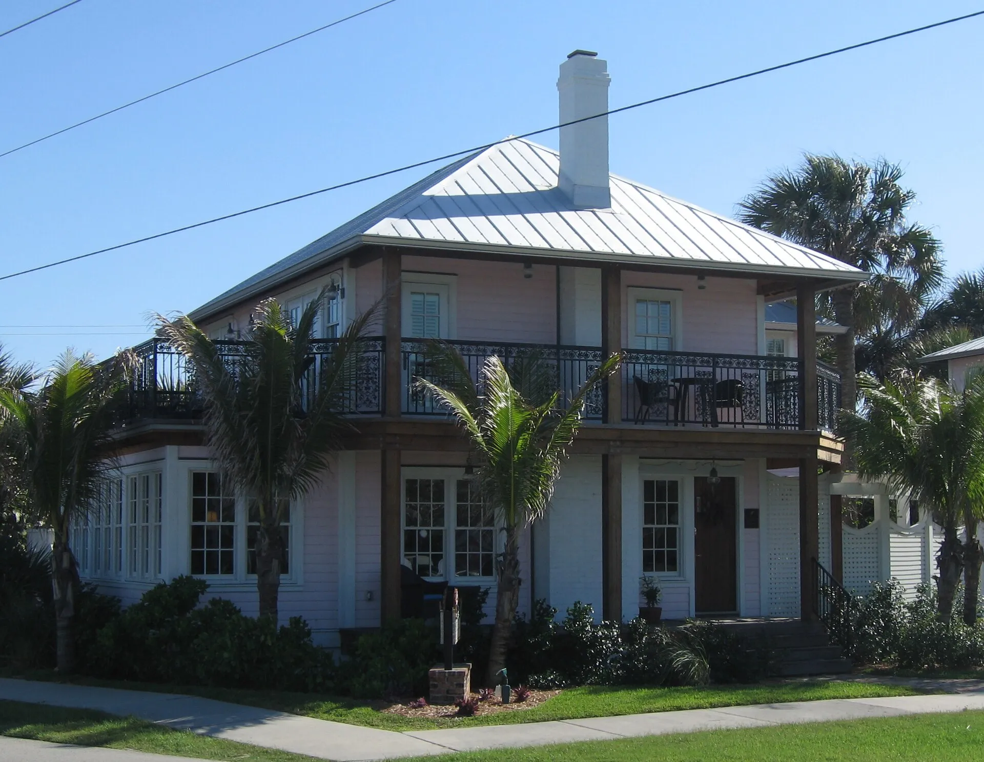 Oblique view of the front of the Pink House, 201 Ocean Avenue, Melbourne Beach, Florida.