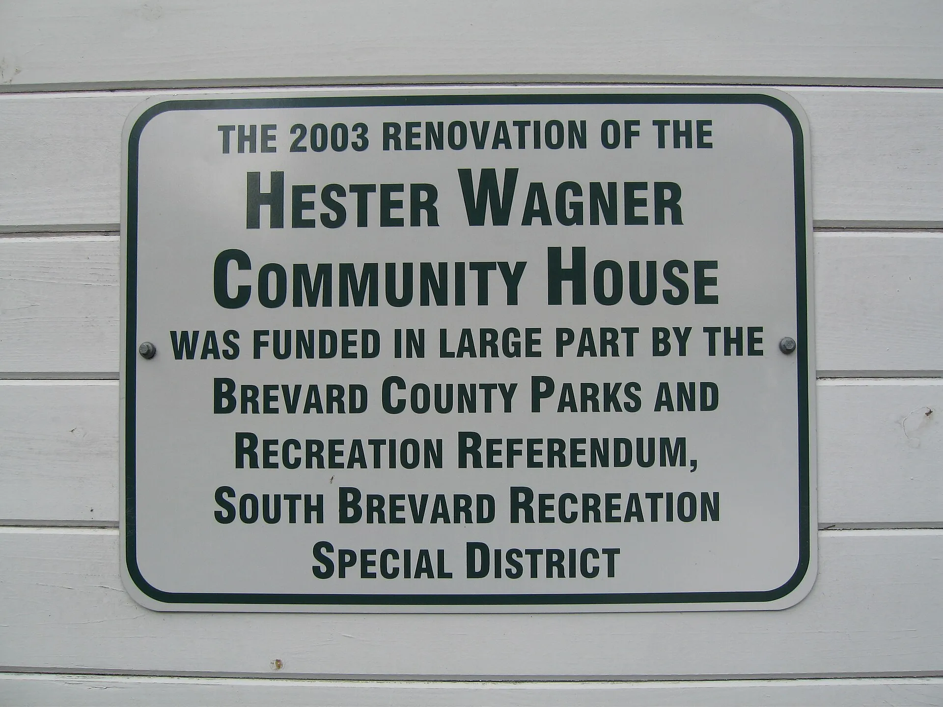 Sign on the front of the Original Melbourne Village Hall, Melbourne Village, Florida.