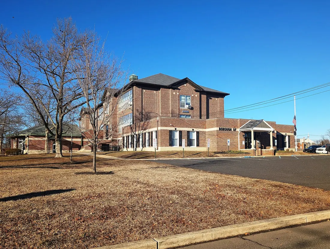 Photo of the Alice Costello School building Brooklawn, New Jersey. The building has additions containing the Brooklawn Borough Hall, the Brooklawn Police Department, and the Flowers Library and Media Center. Photo taken