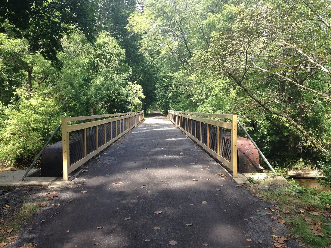 The Pennypack Trail passing over the Pennypack Creek on a former railroad bridge north of the former Bryn Athyn station in Bryn Athyn, Pennsylvania