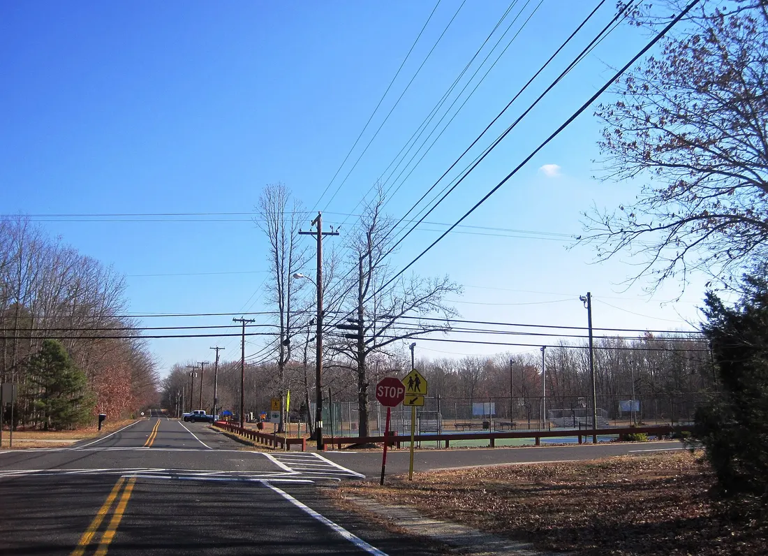Photo of eastbound County Route 680 (Center Avenue) in Chesilhurst, New Jersey with a view of Leanna Harris Park in the background. Photo taken looking east-southeast approaching CR 718 (4th Avenue).