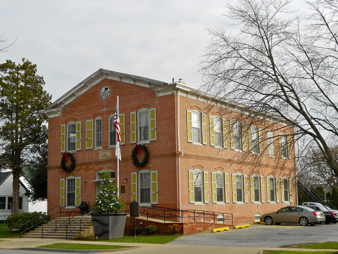 Old school and town hall in the Delaware City Historic District (on the NRHP since December 15, 1983) The historic district is roughly bounded by the Delaware River, Dragon Creek, Delaware Route 9, and the Delaware and