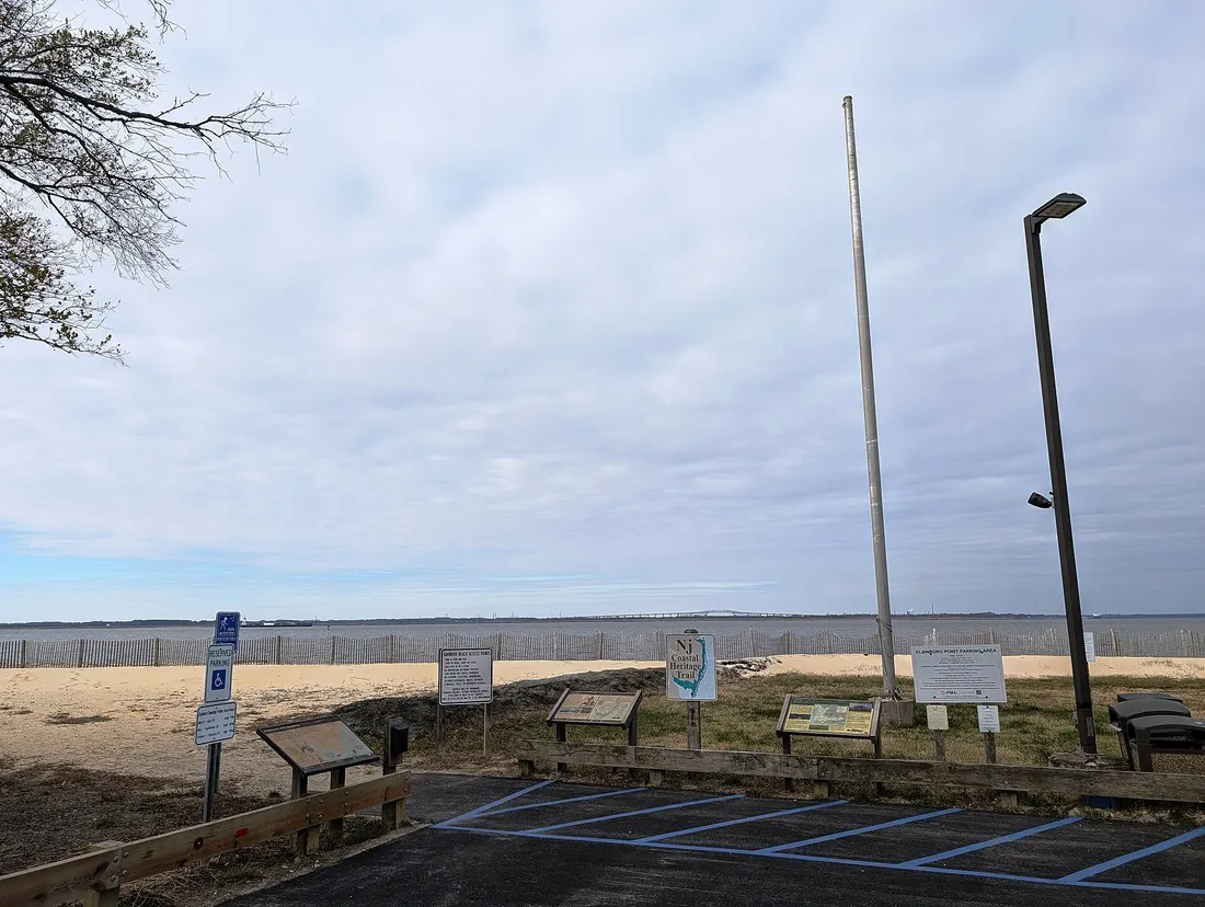 Photo of Oakwood Beach in the community of Fort Elfsborg within Elsinboro Township, New Jersey. The beach is along the Delaware River. The Reedy Point Bridge in Delaware is seen in the background. Photo taken from the be