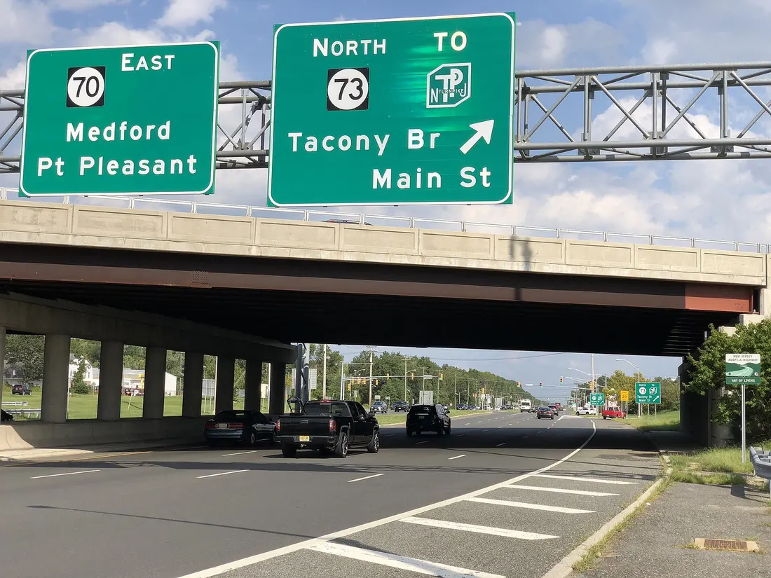View east along New Jersey State Route 70 at the exit for New Jersey State Route 73 NORTH (TO New Jersey Turnpike, Tacony Bridge, Main Street) in Evesham Township, Burlington County, New Jersey