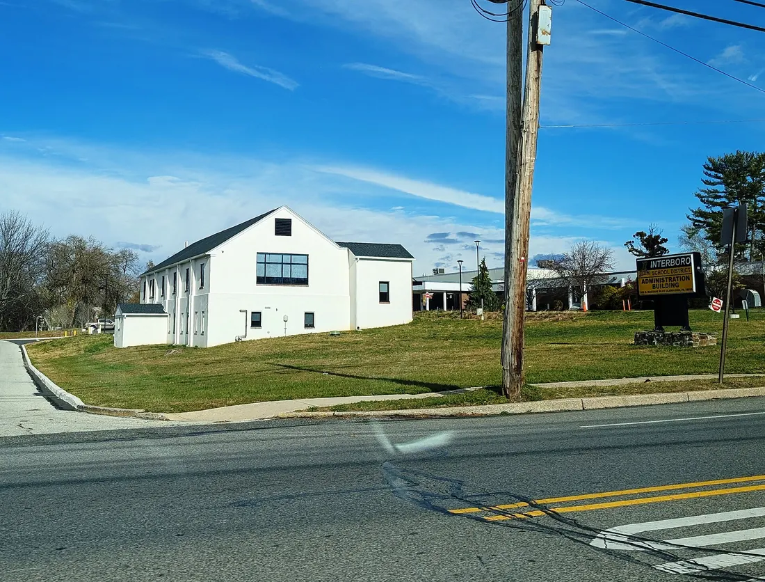 Photo of the Interboro School District Administration Building in Glenolden, Pennsylvania. Photo taken from South MacDade Boulevard at Hibbs Avenue looking north.