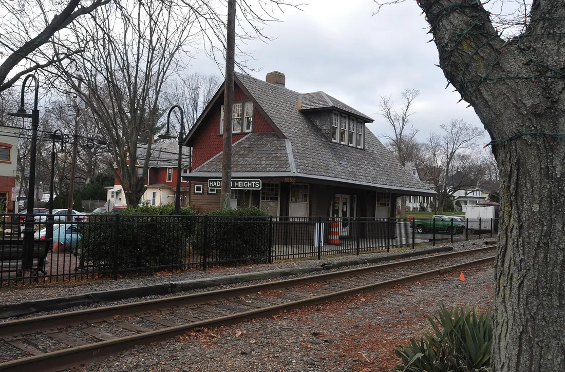 THE STATION IS THE CENTERPIECE OF THE DISTRICT AND LIES DIRECTLY IN THE CENTER. LATE 19TH CENTURY. THE RAILROAD BROUGHT A BOOM TO HADDON HEIGHTS AND THE SURROUNDING AREA