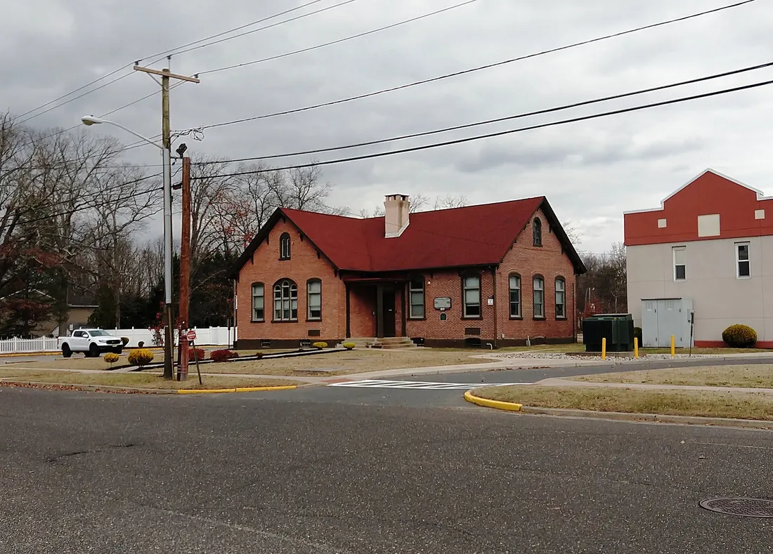 Photo of the Busch Building, a former school in Hainesport Township, New Jersey. The building now houses the offices of Hainesport Township School District. Photo taken from Broad Street looking northeast.
