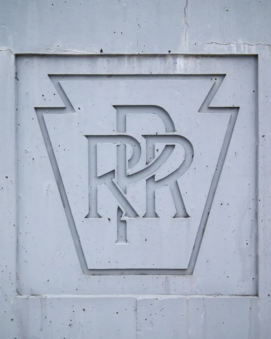 Pennsylvania Railroad emblem on a bridge crossing the main line in Pittsburgh
